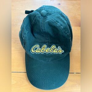 Vintage Cabelas cap.  Adjustable green. Yellow script.